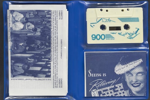 Blue vinyl folder with cassette and printed fanzine