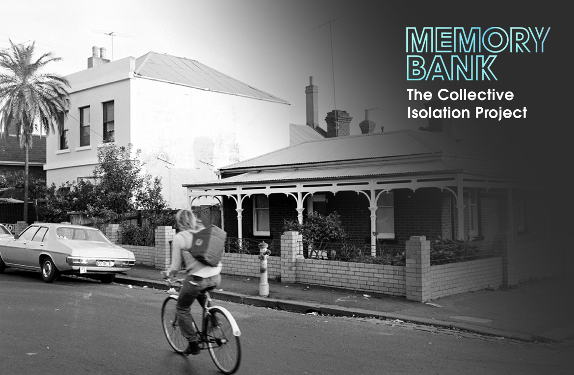 A blonde man rides a bicycle down a suburban street