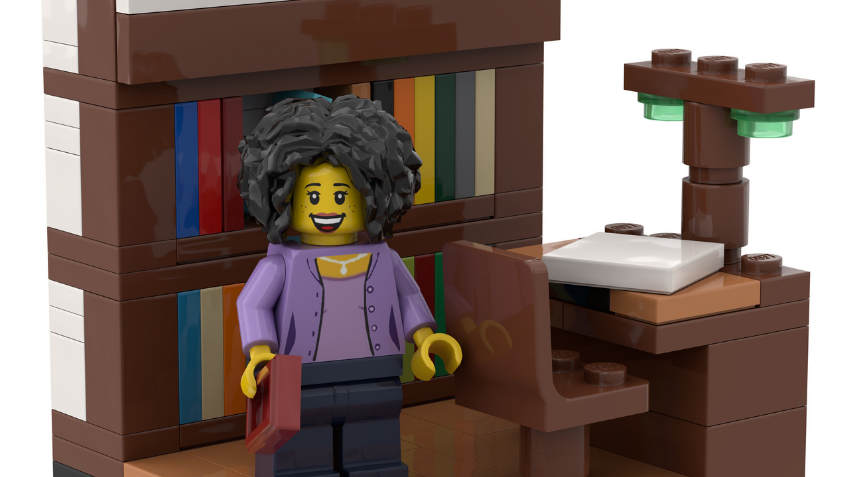 A LEGO set of a librarian standing in front of a book shelf