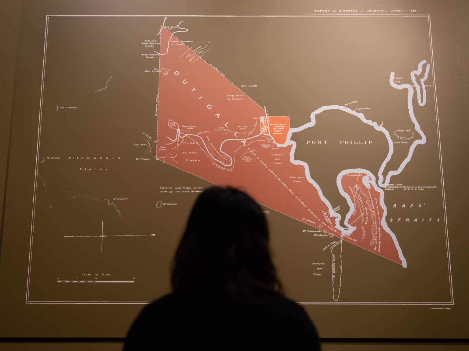 A person standing in front of a map within the Treaty exhibition space