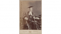 Sepia photo of a man in long robes