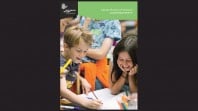 black background with annual report cover featuring children