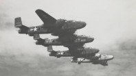 Four B17 bombers in flight during World War II, probably near Borneo