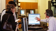 Staff member assisting users at the information desk