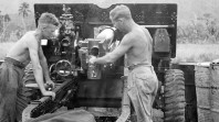 Soldiers operating a 25-pounder field gun against the Japanese in the Dagua area