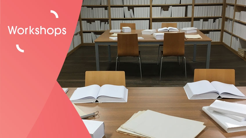 Photo of ‘The White Library’ by Wilfredo Prieto, a conceptual artwork comprised of more than 5000 blank white books, presented on shelves in a reading room or library. In the room are tables and chairs with a selection of white books open to display their blank interiors.