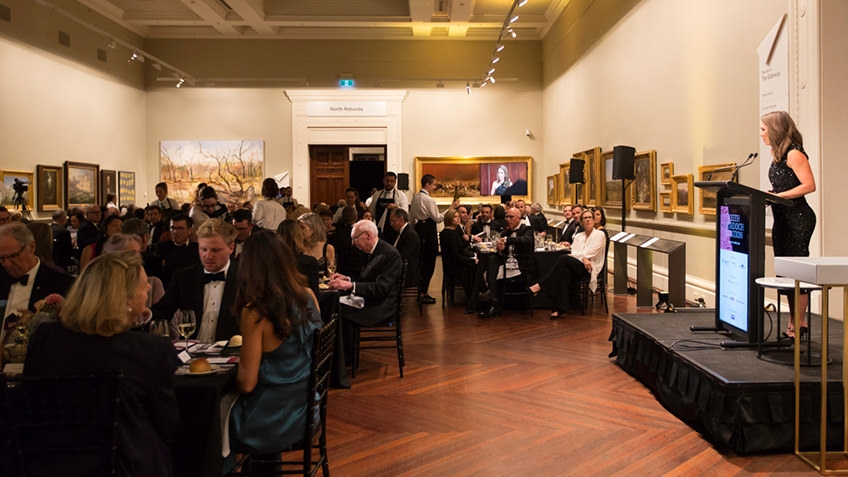 Speaker addresses diners in Cowen Gallery