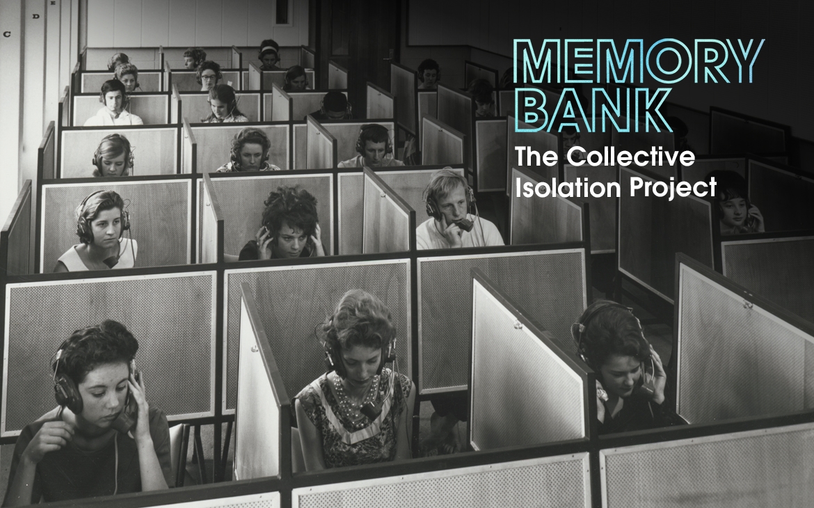 People wearing headphones sit in a grid of small booths