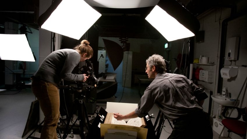 Image of two people working in the digital imaging studio