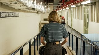 Woman walking down a hallway