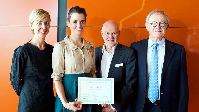 Photo of Jorja Kelly (second from left, accepting the 2015 Barrett Reid Scholarship on behalf of Paula Kelly) with Kate Torney, CEO State Library Victoria, John Murrell, President Public Libraries Victoria Network and Dennis Goldner, Library Board of Victoria.