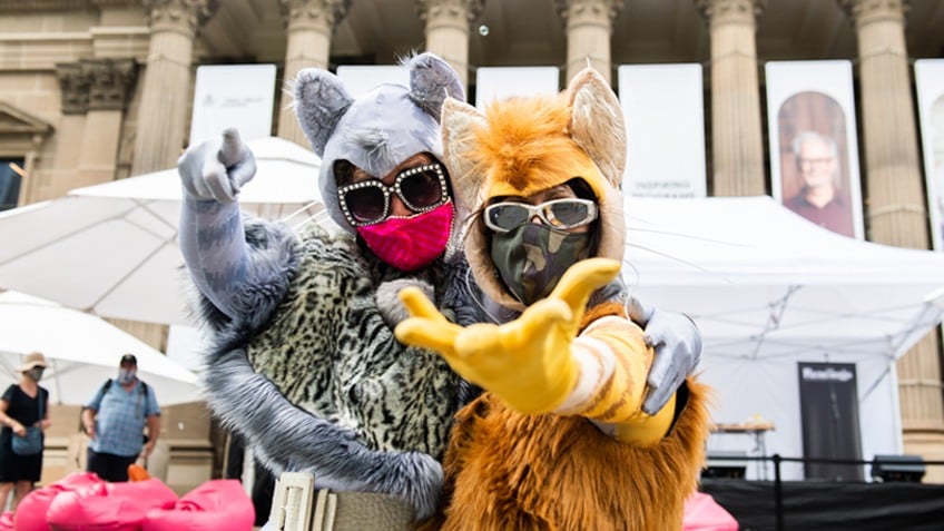 Two people in animal costumes dancing