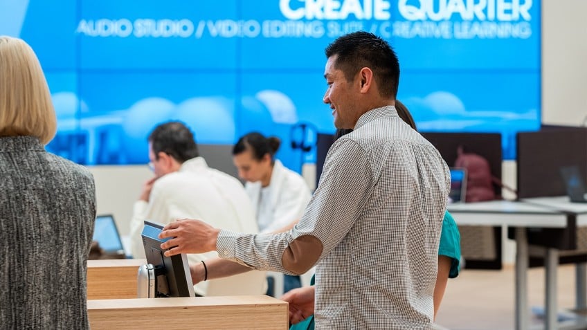 people at kiosks in workspace