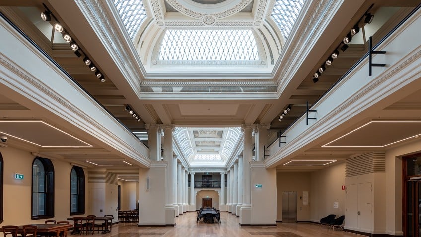 long view of grand hall with skylights and coffered ceiling