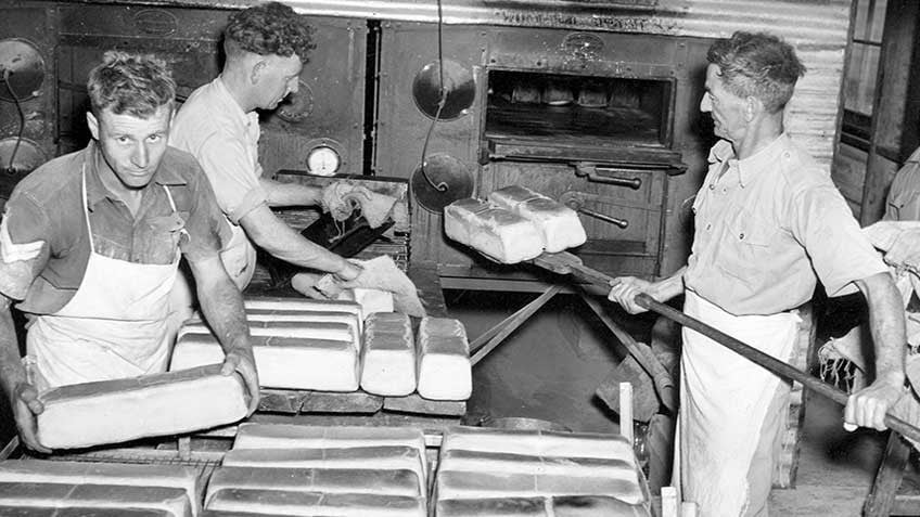 Australian Army bakers stacking the bread ready for distribution during World War II