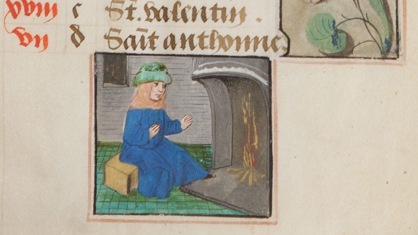 detail from medieval manuscript of woman seated before fire