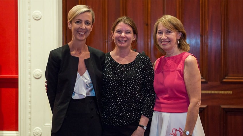 photograph of three simling women at an award ceremony at State Library Victoria 