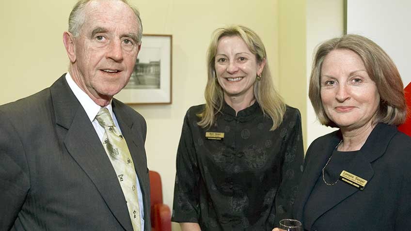 colour photo of 2006 Barrett Reid Scholarship recipients Lorraine Seeger and Bernardine Nolan with the Hon John Cain, then president of the Library Board of Victoria