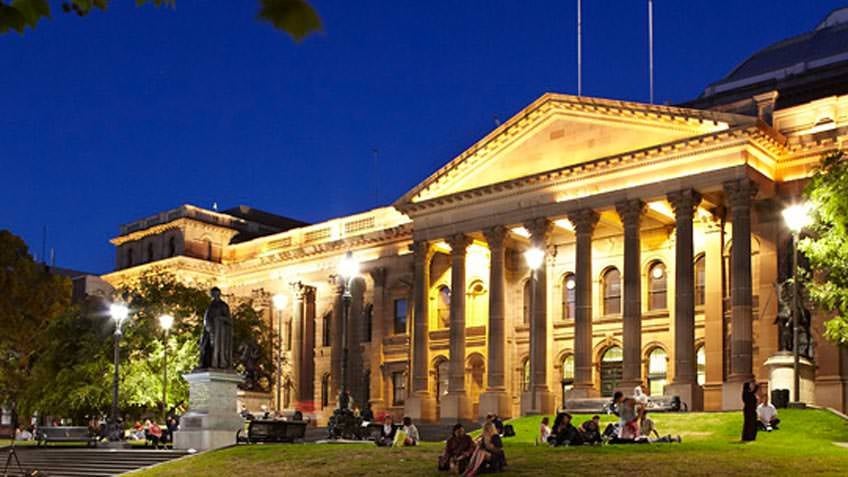 colour photo of State Library facade at night