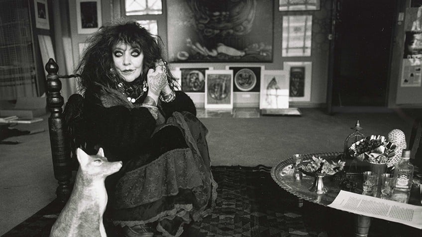 Black and white photograph of artist Vali Myers in her studio