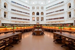 Horizontal view of reading desks and gallery balconies in octagonal reading room
