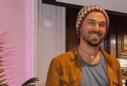 smiling man wearing a beanie