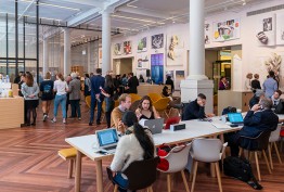 RSWZ Library Russell Street foyer with cafe customers, whie pillars and people at desks