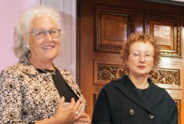 Robyn Oswald-Jacobs and Dr Nanette Carter two smiling women outside ornate wooden door