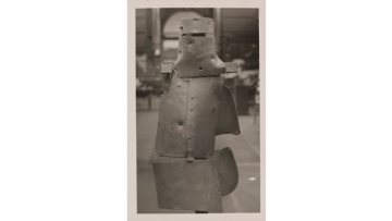 Black and white image from 1933 of Ned Kelly's armour on display at the Exhibition Building in Carlton Gardens