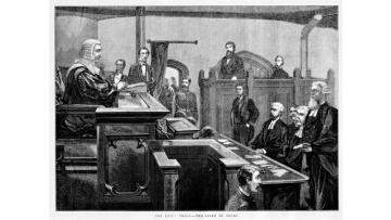 Black and white wood engraving of Ned Kelly's trial. Kelly is in the dock, while Redmond Barry oversees the case wearing the wig and robes of the British legal system.