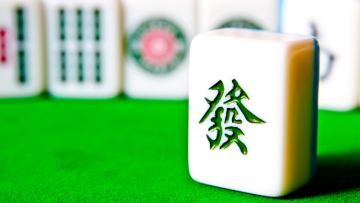 A single Mahjong tie on a table