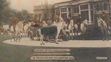 Photo of people on horseback forming an honour guard around a car