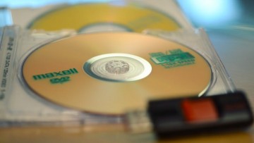 Photo of some DVDs and a USB drive