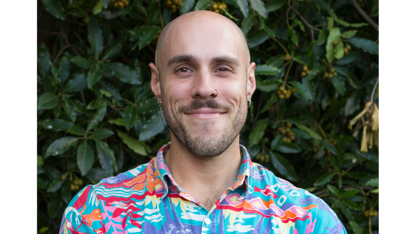 Author Dan Giovannoni wearing a colourful summer shirt.
