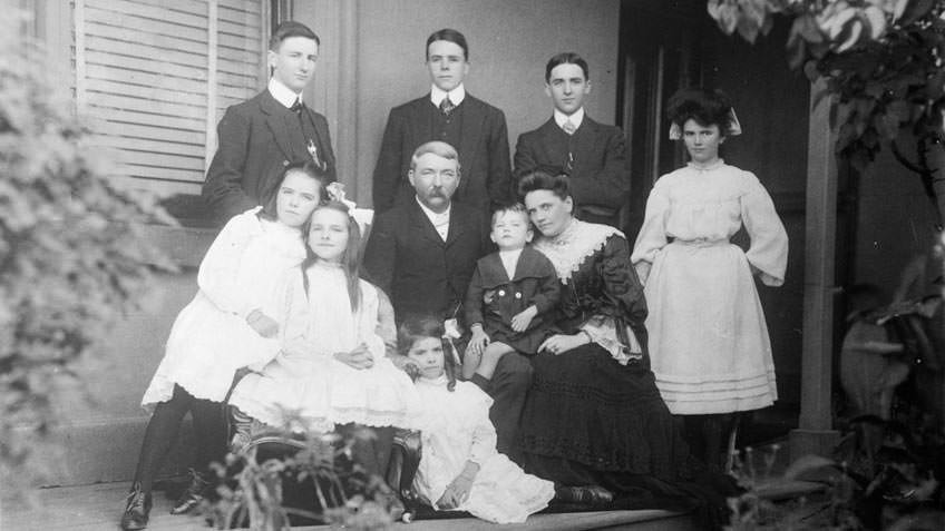 Black and white photographic portrait of an extended family