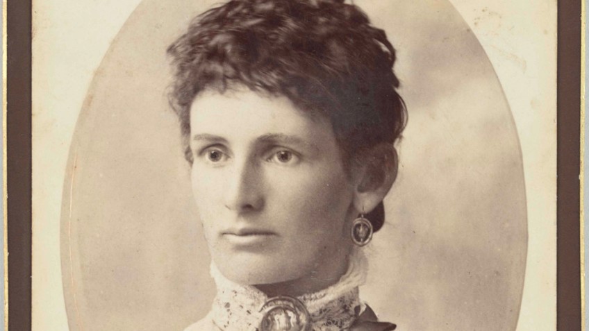 Sepia portrait of a woman in Victorian clothes