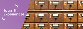 Image of the Library's old card catalogues. On the left there is a purple graphic overlay with white text saying 'tours and experiences'.