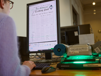 A patron using the computer searching through newspapers