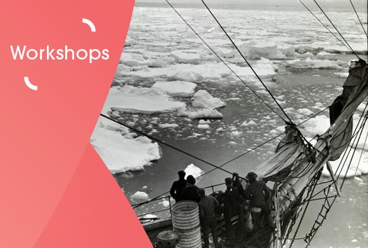 A black and white photo of a ship with people looking out at a sea of icebergs